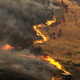 Members of crew work on the fire line in Santa Clarita, California on Sunday. (AP/Ringo H.W. Chiu)